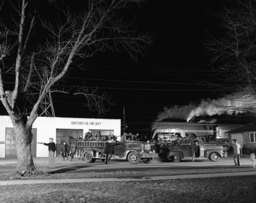  A night photograph of the Grottoes Fire department loading into two fire trucks, while a steam engine puffing smoke roars past in the background. This was one of Link’s most successful staged nighttime photographs. The men in the picture are, from left to right: Claude Spitzer, Howard Dean, Donaol Waters, Charles Stickley, Austin Kibly, Frank Becks, and Henry Hoffman.  