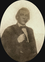 This is the only known surviving photograph of Traverse Benjamin Pinn Sr., a Black statesman, entrepreneur, and inventor. He is wearing a dark suit and tie, and his hair is pulled back. The photograph was most likely taken around 1885. Pinn was killed in an apparent homicide in March of 1888.  