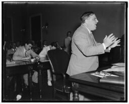 In this photograph, taken on August 3, 1937, New York City Mayor Fiorello La Guardia speaks before the 75th United States Congress on behalf of the United States Conference of Mayors, urging the passage of the Wagner-Steagall Housing Act. La Guardia forcefully argued that thousands of residents of New York City were living in “firetraps” and “dangerous surroundings,” conditions that housing reform could prevent.  