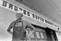 layton K. Grubbs stands in front of his store, Grubb’s Super Market, in 1980.