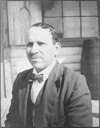 George F. “Thunder Cloud” Custalow, the chief of the Mattaponi tribe from 1914 to 1949, sits in a suit and bowtie in this 1918 outdoor photographic portrait. A politically active chief, Custalow had worked to ensure that tribal members were recognized as “non-citizen Indians” during the World War I Selective Service Draft, and that tribal members would be exempt from state and local taxation. This photograph was taken by ethnologist Frank G. Speck. 